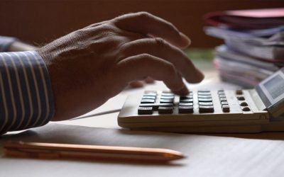 hand on calculator retirement business